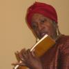 Gwen Gilyard reading from one of the books she has written for children; Grinnell Centennial Party, October 17, 2010 (Photo: Sally Kahan)