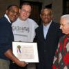 Wayne Benjamin displaying the official Centennial Citation from Councilman Jackson's office.  (Photo: Lynne Van Auken)