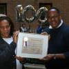 Grinnell residents Robin Johnson and Wayne Benjamin displaying the official Centennial Citation from Councilman Jackson's office.  (Photo: Lynne Van Auken)